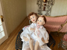 Load image into Gallery viewer, Signed MT BT 1999 Mother & Baby Doll in Brown Wicker Chair