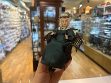 Load image into Gallery viewer, Dollhouse Miniatures ~ The London Supply Older Lady Doll in Green Dress Sitting in Brown Wicker Chair