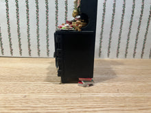 Load image into Gallery viewer, Decorated Black Cabinet with Cookies, Gingerbread Men, Etc. for Christmas
