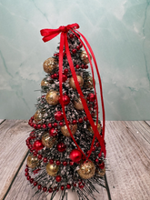 Load image into Gallery viewer, Artisan Hand Decorated Snow Frosted Medium Christmas Tree Gold Ornaments &amp; Red Bow
