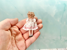 Load image into Gallery viewer, Curly Shirley Blonde Hair Popular Little Girl from 1930s Small Porcelain Doll in White Dress with Red Polka Dots

