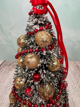Load image into Gallery viewer, Artisan Hand Decorated Snow Frosted Medium Christmas Tree Gold Ornaments &amp; Red Bow
