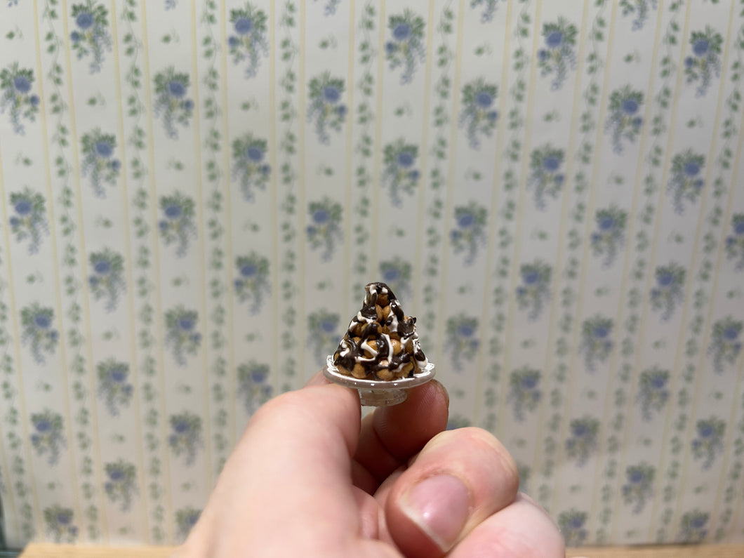 Cream Puff Pastry Tower with Chocolate Sauce Drizzle