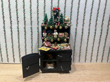 Load image into Gallery viewer, Decorated Black Cabinet with Cookies, Gingerbread Men, Etc. for Christmas
