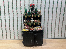 Load image into Gallery viewer, Decorated Black Cabinet with Cookies, Gingerbread Men, Etc. for Christmas
