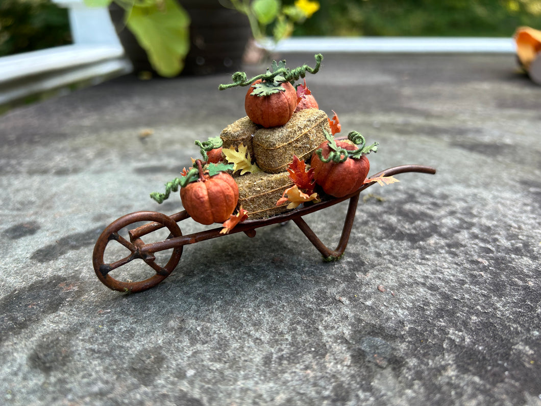 Wheelbarrow with Pumpkins & Bales of Hay