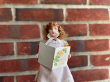 Load image into Gallery viewer, Little Girl Doll Christmas Caroler Holding Sheet Music Book
