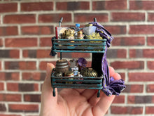 Load image into Gallery viewer, Dollhouse Miniatures ~ Halloween Rolling Cart full of Potions with Purple Witch’s Robe
