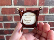 Load image into Gallery viewer, Dollhouse Miniatures ~ John Hodgson 1997 Resincast Wooden Arm Chair with Blue &amp; Green Striped Cushion
