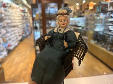 Load image into Gallery viewer, Dollhouse Miniatures ~ The London Supply Older Lady Doll in Green Dress Sitting in Brown Wicker Chair
