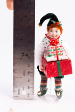 Load image into Gallery viewer, Handmade Porcelain Christmas Elf Doll Holding Presents - Fern Vasi
