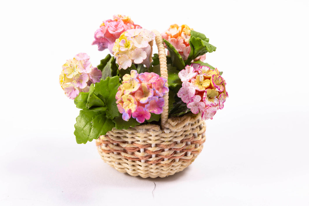 Pink Hydrangea Flowers in Wicker Basket by Laura Crain