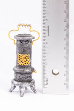 Load image into Gallery viewer, Metal Parlor Stove with Gold Accents

