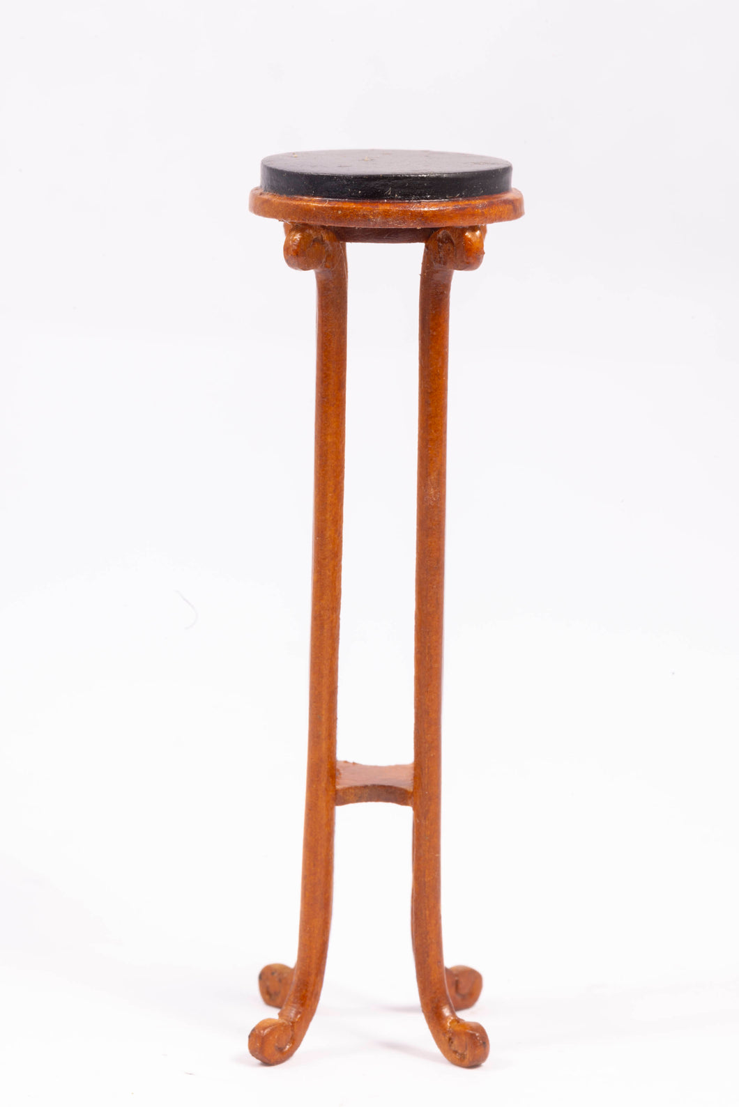 Tall wooden plant stand with black top