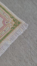 Load and play video in Gallery viewer, Dollhouse Miniature ~ Petit Point Coral &amp; Cream Ornamental Rug with Rococo Flourishes and Central Bloom- Ursula Sauerberg
