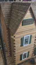Load and play video in Gallery viewer, Ponderosa Log Cabin Christmas Dollhouse Electrified With Working Train
