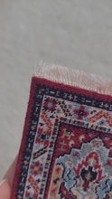 Load and play video in Gallery viewer, Dollhouse Miniature ~ Petit Point Tribal Rug with Mirrored Emblems and Geometric Border - Ursula Sauerberg
