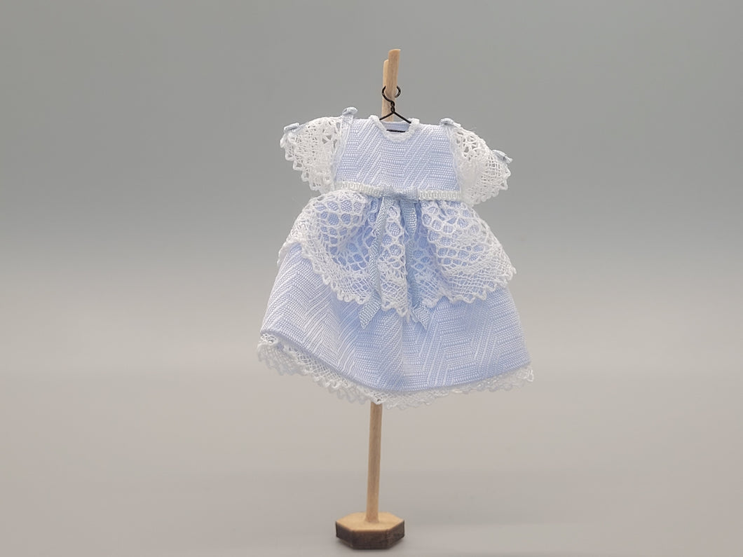 Blue Dress with White Lace Detailing on Wooden Stand - by Cheryl Warder
