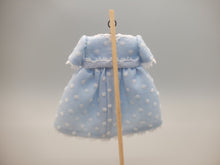 Load image into Gallery viewer, Blue and White Polka Dot Dress with Bow on Wooden Stand – by Cheryl Warder
