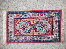 Load image into Gallery viewer, Dollhouse Miniature ~ Petit Point Tribal Rug with Mirrored Emblems and Geometric Border - Ursula Sauerberg
