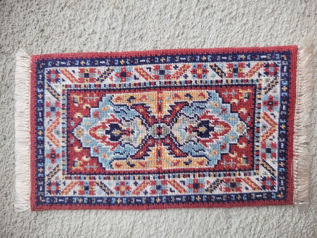 Dollhouse Miniature ~ Petit Point Tribal Rug with Mirrored Emblems and Geometric Border - Ursula Sauerberg