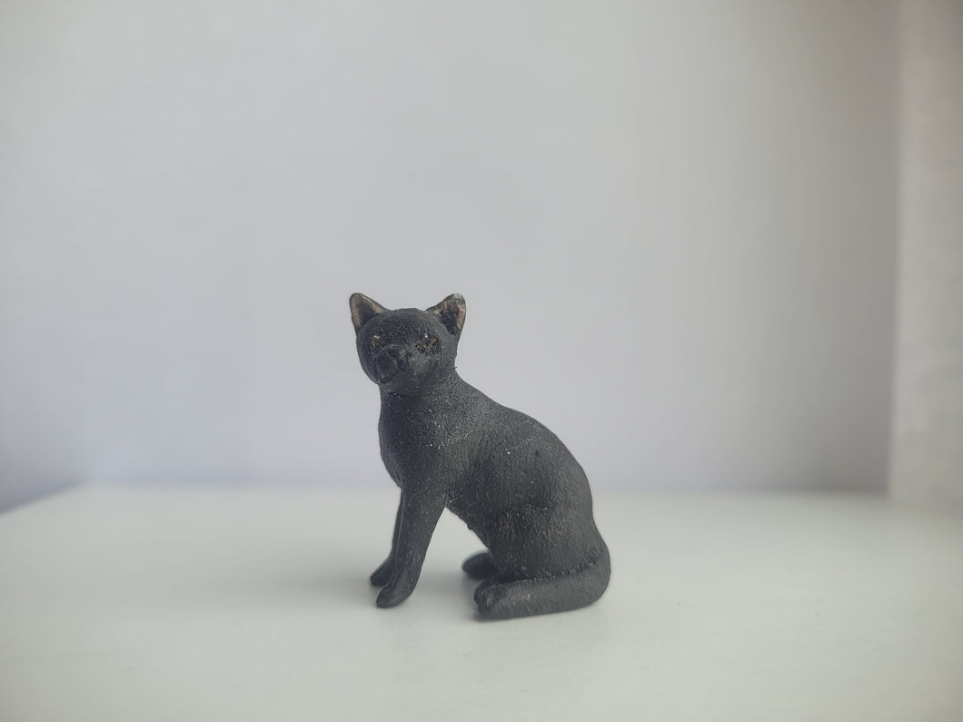 Black Cat Sitting – by Karl Blindheim