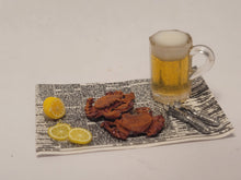 Load image into Gallery viewer, Crabs and Beer with Lemon on Newspaper
