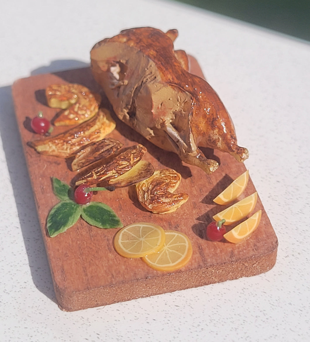 Duck roast with orange slices on board