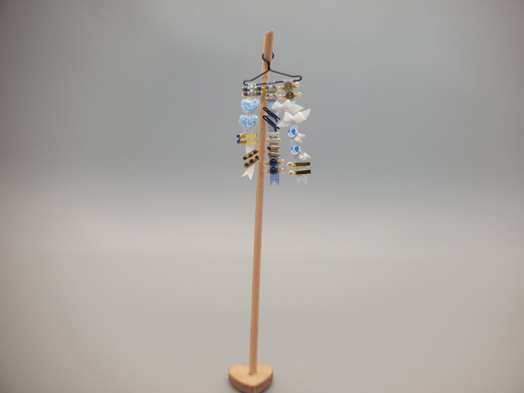 Baby Blue Ribbons & Barrettes on Wooden Stand - by Cheryl Warder