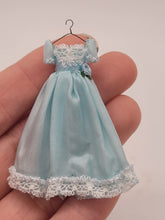 Load image into Gallery viewer, Dollhouse Miniature ~ 1:24 Scale, Blue Dress with White Lace Details on Wire Hanger
