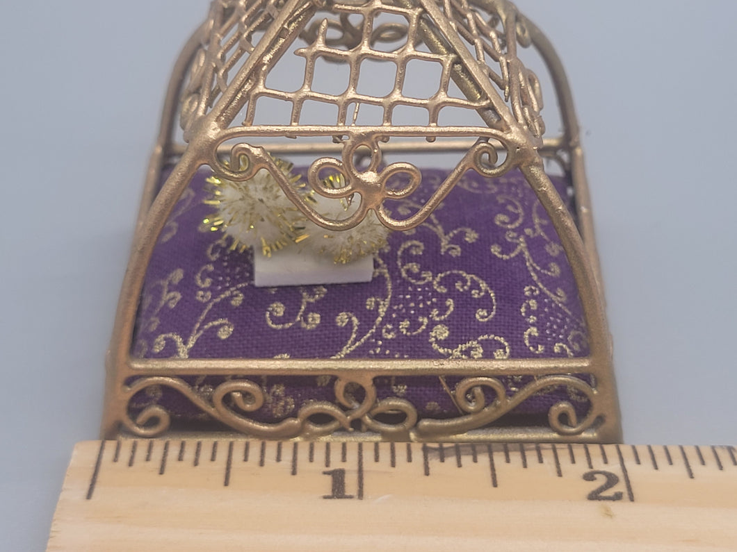 Gold Painted Metal Cat Bed with Ornate Purple Cushion