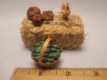 Load image into Gallery viewer, Haybale with Chicken and Cucumbers in Woven Basket
