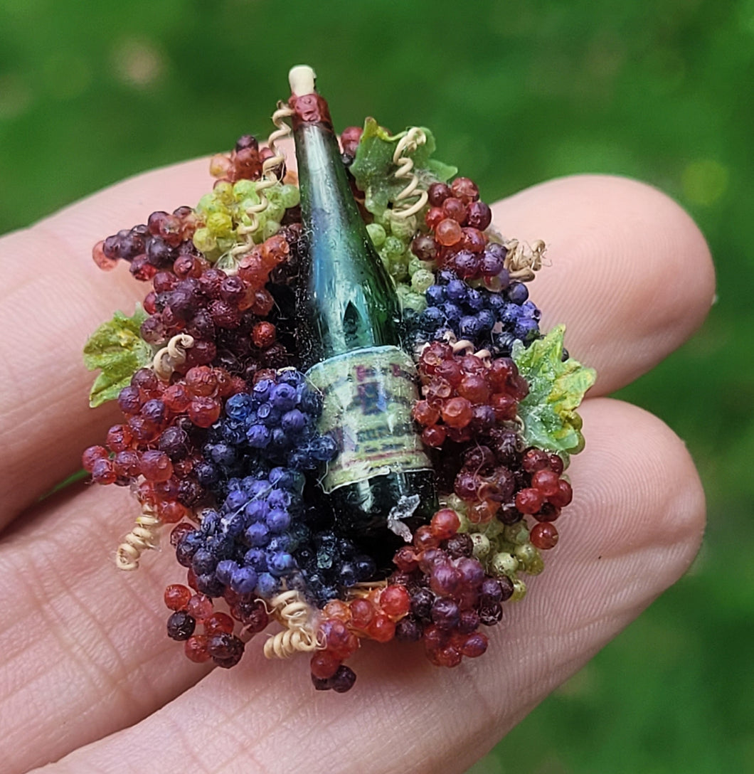 Wine in Glass Bottle with Grapes