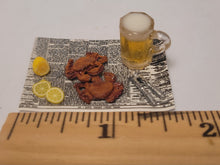 Load image into Gallery viewer, Crabs and Beer with Lemon on Newspaper
