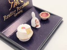 Load image into Gallery viewer, Dollhouse Miniature ~ Bell, Cake, and Bowl with Santa Image - Reutter Porcelain
