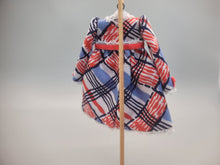 Load image into Gallery viewer, Red, White, and Blue Design on Dress with Red Bow on Wooden Display – by Cheryl Warder
