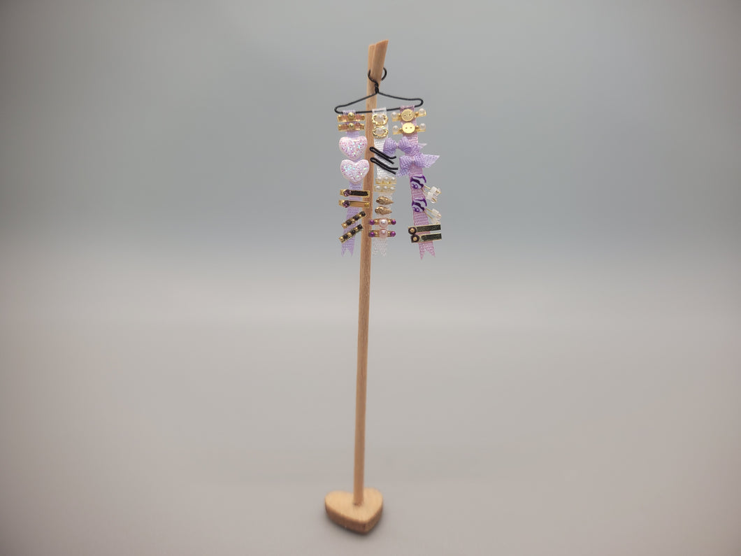 Purple Ribbons and Barrettes for Little Girl on Wooden Display – by Cheryl Warder