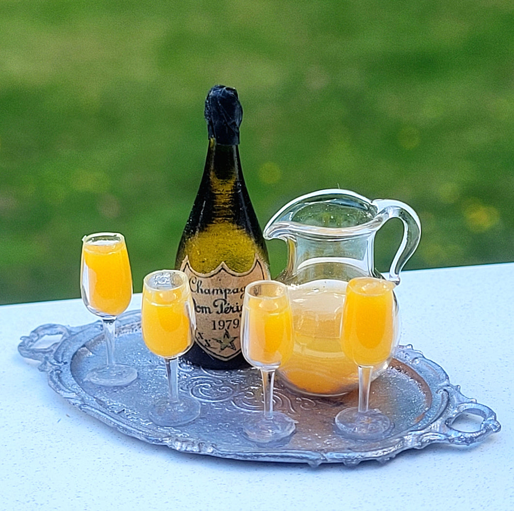 Mimosas with Champagne, Glass Pitcher, and Glass Flutes on Metal Platter
