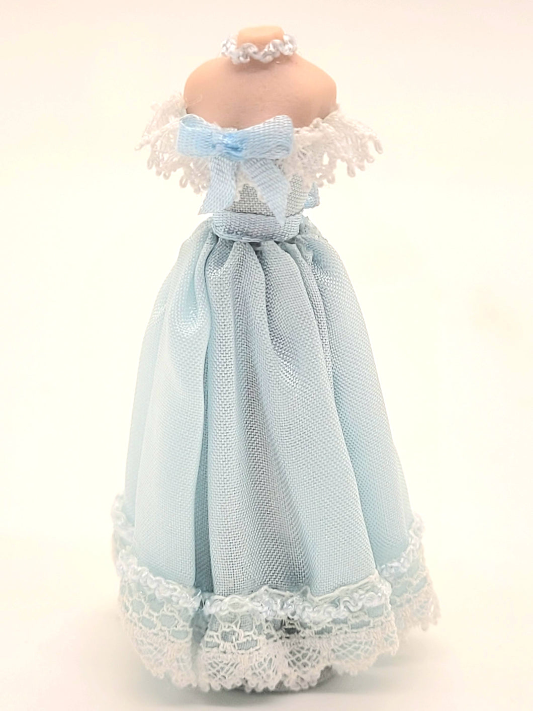 Blue Off-Shoulder Dress with Lace, Bow, and Necklace on Mannequin