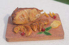 Load image into Gallery viewer, Duck roast with orange slices on board
