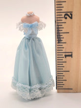 Load image into Gallery viewer, Blue Off-Shoulder Dress with Lace, Bow, and Necklace on Mannequin
