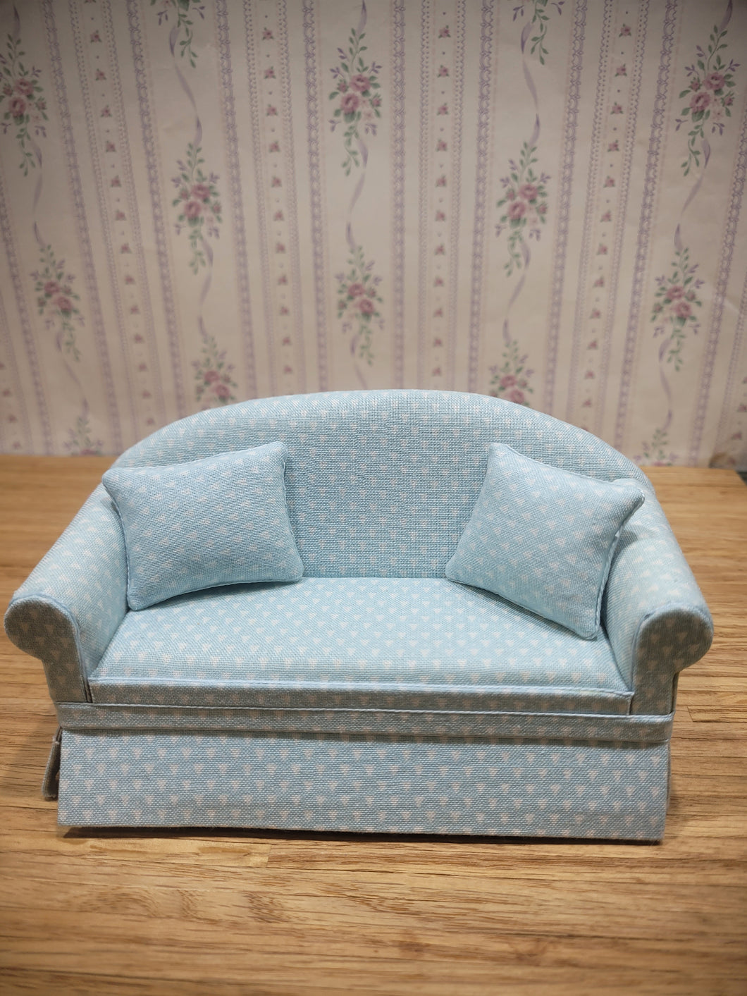 White Triangle Pattern on Light Blue Couch