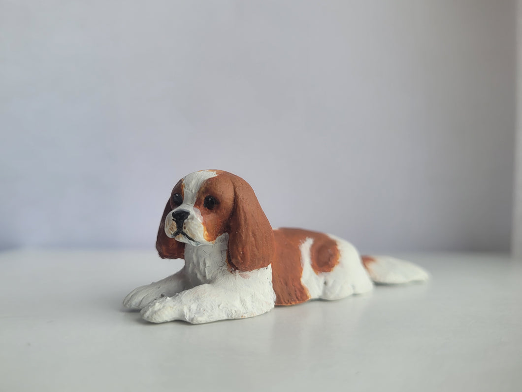 Cavalier King Charles Spaniel Laying Down – by Karl Blindheim
