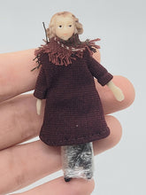 Load image into Gallery viewer, Dollhouse Miniature ~ 1/2&quot; Scale, Female Doll with Red Coat and Scarf with Black Pants &amp; Shoes
