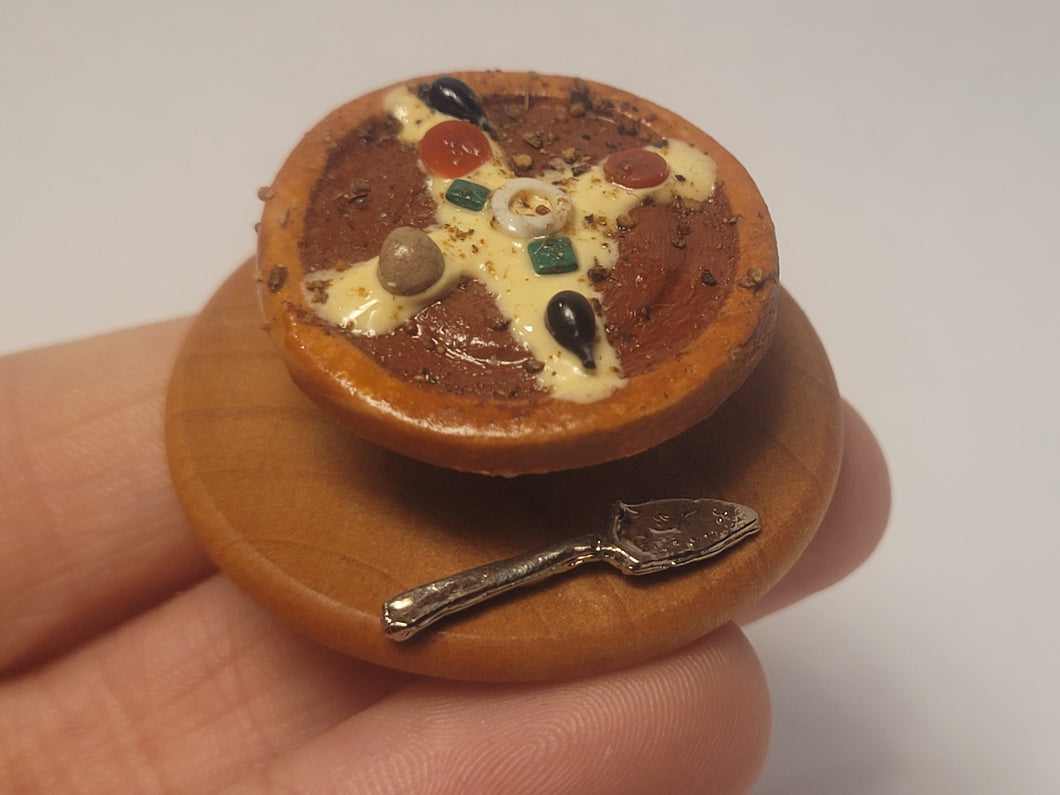 Pizza with Server on Wooden Board