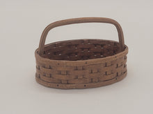 Load image into Gallery viewer, Al Chandronnait – Oval Woven Brown Basket with Handle Bar
