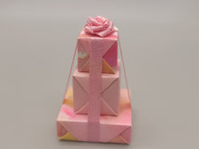 Load image into Gallery viewer, 3 Tier Presents Wrapped in Pink and Yellow Paper with Pink Bow
