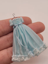 Load image into Gallery viewer, Dollhouse Miniature ~ 1:24 Scale, Blue Dress with White Lace Details on Wire Hanger
