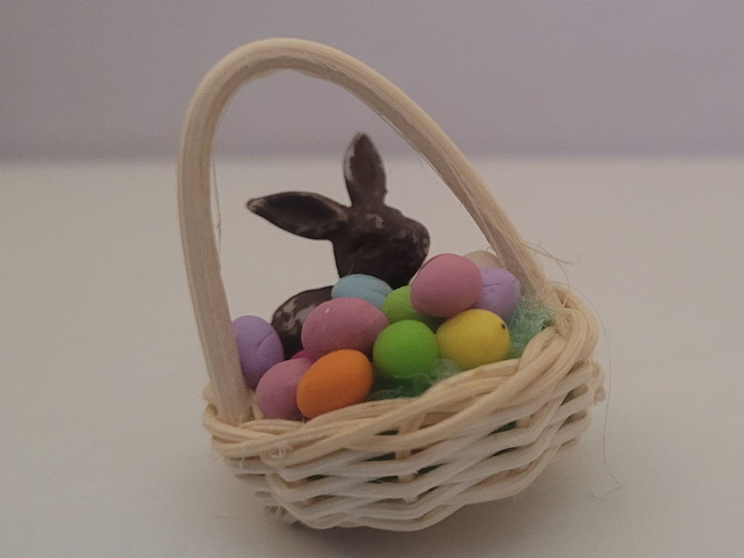Easter Basket with Colored Eggs and Chocolate Bunny