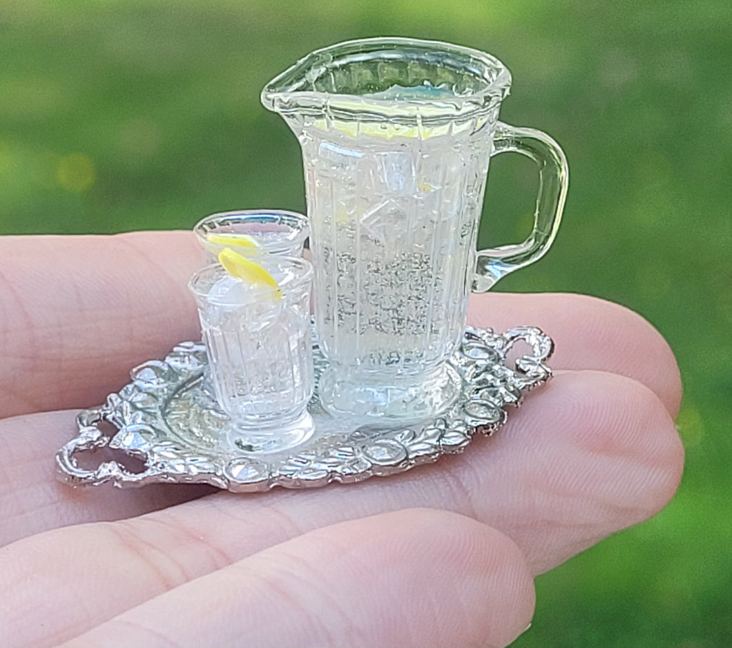 Lemon Ice Water on Metal Platter